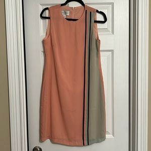 Boutique dress. Retro vibes. Melon color with green details. Size 4. Like new.